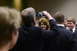 An individual photographs U.S. Sen. Lisa Murkowski during the social hour at the ASYMCA’s 40th annual Salute to the Military at the Dena’ina Center, Anchorage, Alaska, Feb. 18, 2017. Since the Navy League’s conception of the ASYMCA in 1977, the program has annually honored all branches of service and has become the longest-running annual event hosted by a non-profit organization.