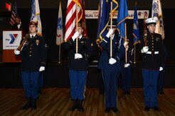 The joint service color guard performs a flag ceremony during the ASYMCA’s 40th annual Salute to the Military at the Dena’ina Center, Anchorage, Alaska, Feb. 18, 2017. Since the Navy League’s conception of the ASYMCA in 1977, the program has annually honored all branches of service and has become the longest-running annual event hosted by a non-profit organization.