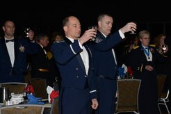Air Force Col. George T.M. Dietrich III (center), 673d Air Base Wing and Joint Base Elmendorf-Richardson commander, and Air Force Chief Master Sgt. Garry Berry II, 673d ABW and JBER command chief master sergeant, toast the POW/MIA table ceremony during the ASYMCA’s 40th annual Salute to the Military at the Dena’ina Center, Anchorage, Alaska, Feb. 18, 2017. Since the Navy League’s conception of the ASYMCA in 1977, the program has annually honored all branches of service and has become the longest-running annual event hosted by a non-profit organization.