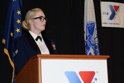 Senior Airman Elizabeth McJannet Bratton, Alaska Air National Guardsman of the year, speaks during the ASYMCA’s 40th annual Salute to the Military at the Dena’ina Center, Anchorage, Alaska, Feb. 18, 2017. Since the Navy League’s conception of the ASYMCA in 1977, the program has annually honored all branches of service and has become the longest-running annual event hosted by a non-profit organization. 