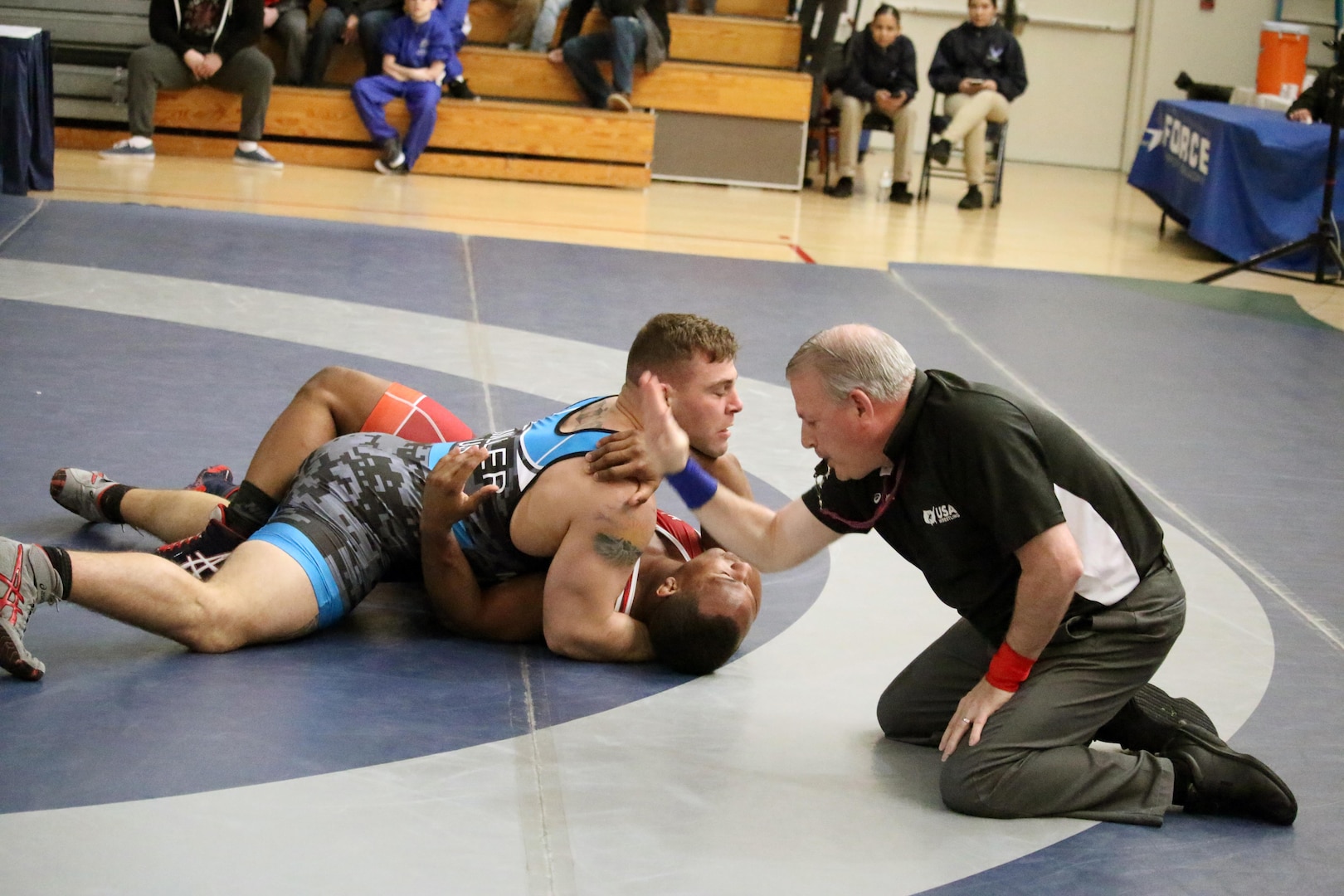 Marine 1st Lt. Daniel Miller pins Army Sgt. Victor Terrell in the 97kg weight class to take the only non-Army gold medal of the tournament during the 2017 Armed Forces Freestyle competition of the Armed Forces Wrestling Championship at Joint Base McGuire-Dix-Lakehurst, New Jersey on 26 February.