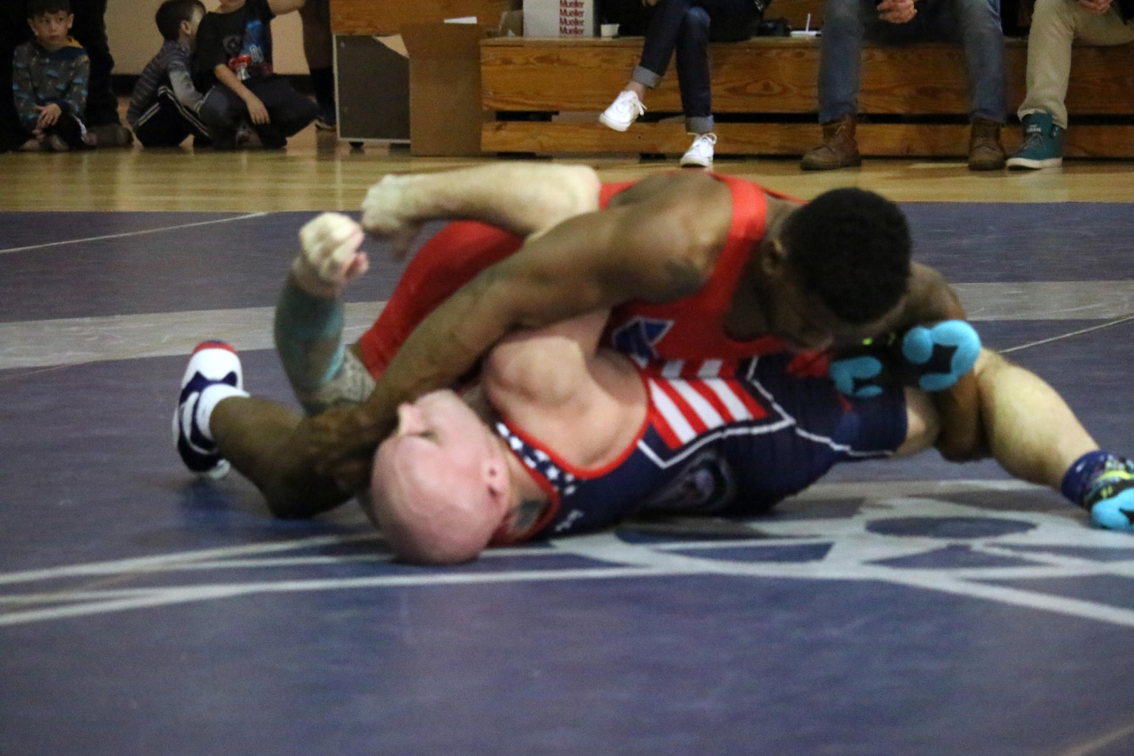 Air Force Senior Airman Brandon Johnson pins Coast Guard Petty Officer 3rd Class Daniel Mazzie in the 86kg weight class to kick off Air Force's comeback in the 2017 Armed Forces Freestyle competition of the Armed Forces Wrestling Championship at Joint Base McGuire-Dix-Lakehurst, New Jersey on 26 February. Navy would hold off the attack as the two heavyweights squared off with Navy winning the final match to place third over Air Force.