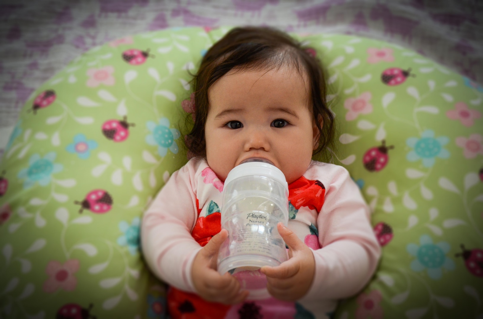Baby Lili, the daughter of Spc. Brianne Kim and her husband, XXX, drinks up.