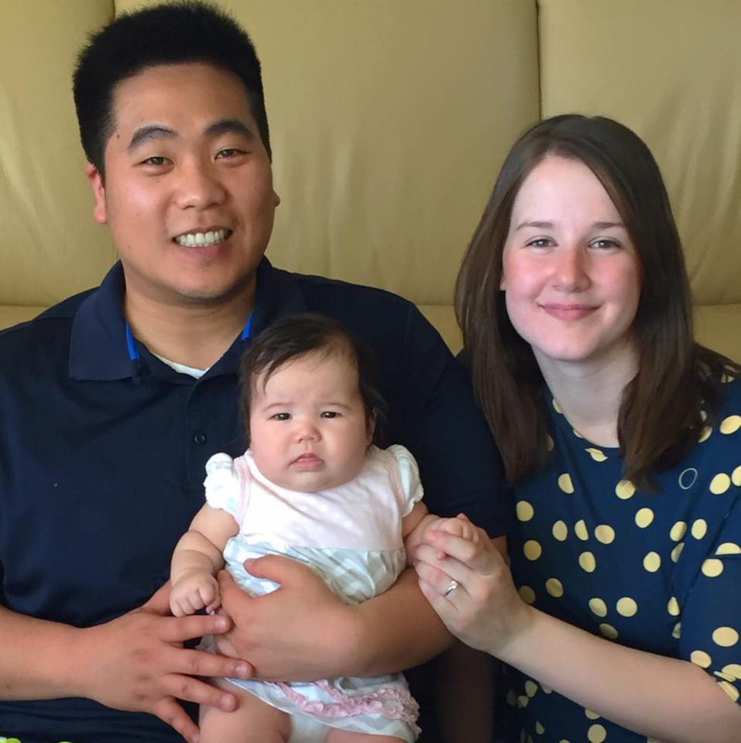 Spc. Brianne Kim, right, poses with daughter Lilly and 
husband, Andy, at home in Washington. 