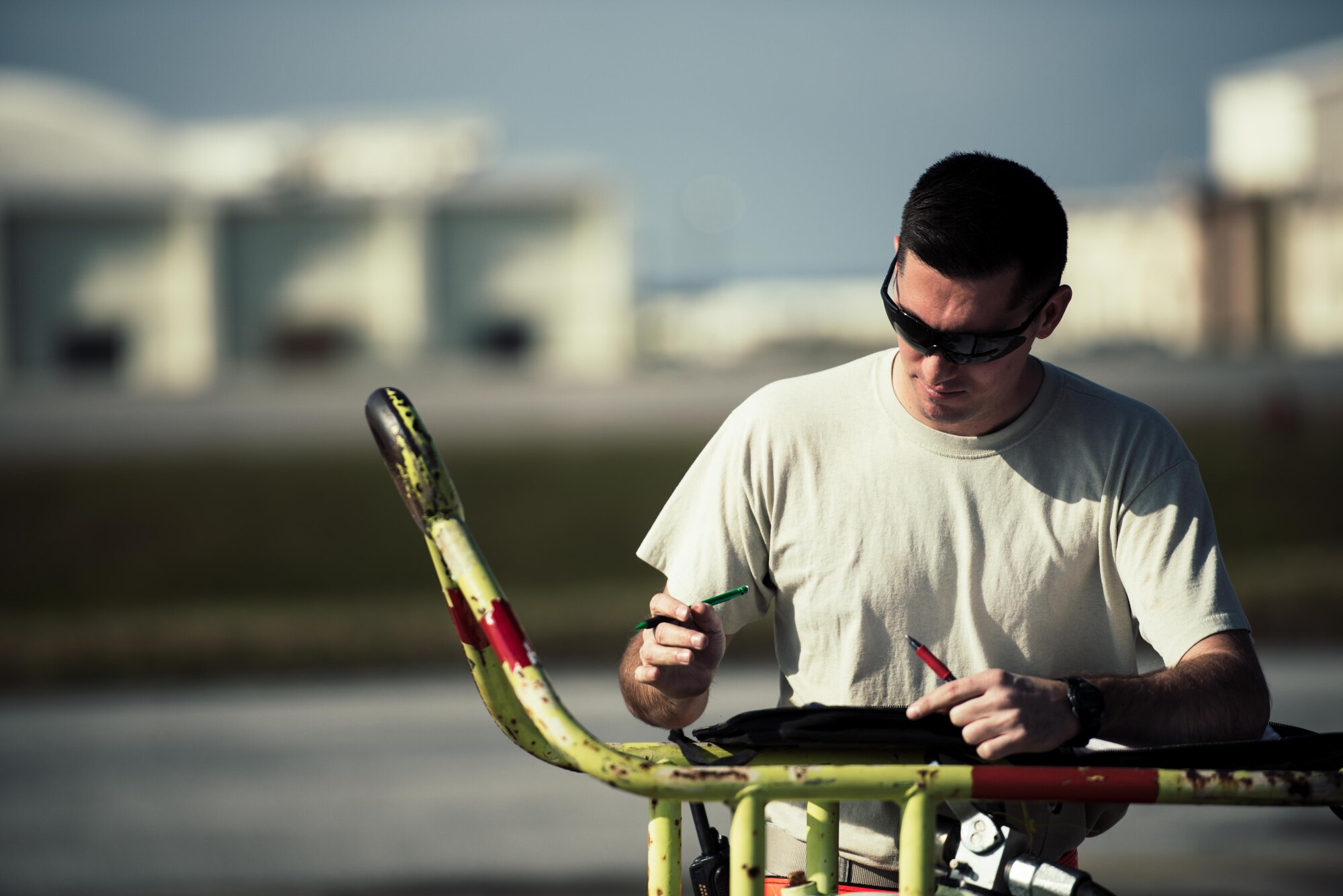 U.S. Air Force Staff Sgt. Nicholas Jaeger, 909th Aircraft Maintenance Unit aerospace propulsion craftsman, documents maintenance on the KC-135R Stratotanker Feb. 16, 2017, at Kadena Air Base, Japan. Aircraft maintainers constantly document any discrepancies and repairs performed during maintenance. (U.S. Air Force photo by Senior Airman Omari Bernard/Released)