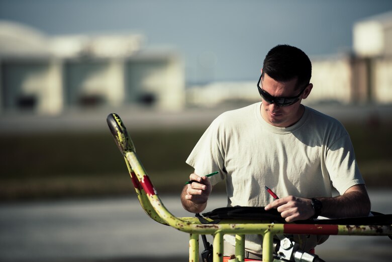 U.S. Air Force Staff Sgt. Nicholas Jaeger, 909th Aircraft Maintenance Unit aerospace propulsion craftsman, documents maintenance on the KC-135R Stratotanker Feb. 16, 2017, at Kadena Air Base, Japan. Aircraft maintainers constantly document any discrepancies and repairs performed during maintenance. (U.S. Air Force photo by Senior Airman Omari Bernard/Released)