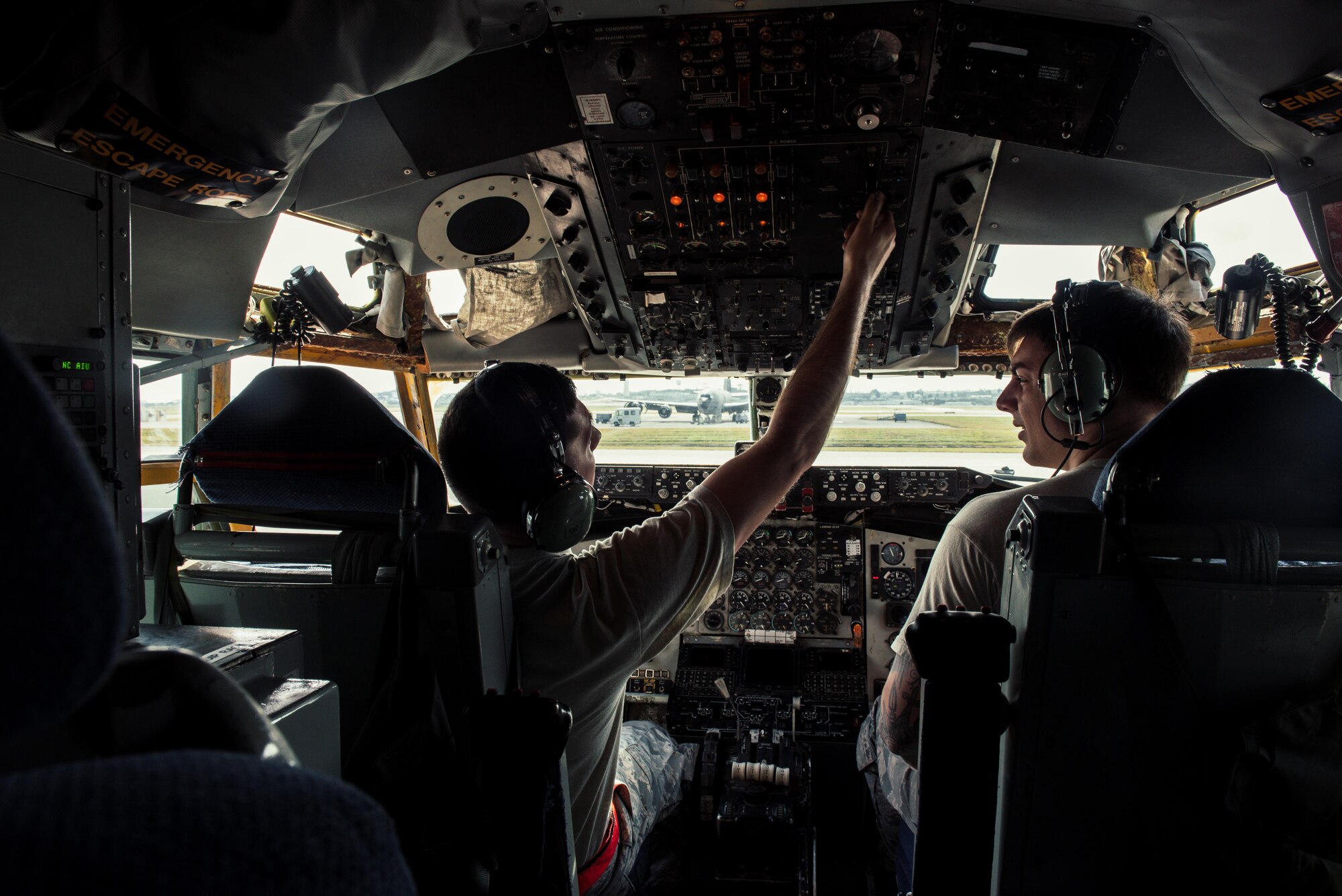 U.S. Air Force Staff Sgt. Nicholas Jaeger and Airman 1st Class Bradley Romaker, 909th Aircraft Maintenance Unit aerospace propulsion technicians, prepare to conduct an engine power run onboard a KC-135R Stratotanker Feb. 16, 2017, at Kadena Air Base, Japan. Aerospace propulsion technicians maintain engines to ensure safety of flight.  (U.S. Air Force photo by Senior Airman Omari Bernard/Released)