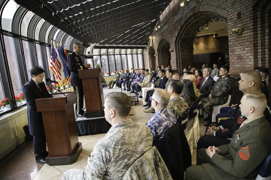 Gen. Vincent K. Brooks, and Command Sgt. Maj. Steven L. Payton, commander and command sergeant major of United States Forces Korea Command, joined USFK senior leaders and Republic of Korea Minister of Patriots and Veterans Honorable Mr. Park, Sung Choon to honor the sacrifice and commitment of USFK service members, during a coin presentation ceremony on U.S. Army Garrison, Yongsan, Republic of Korea, Dec. 19. (U.S. Army photo by SFC Sean K. Harp)