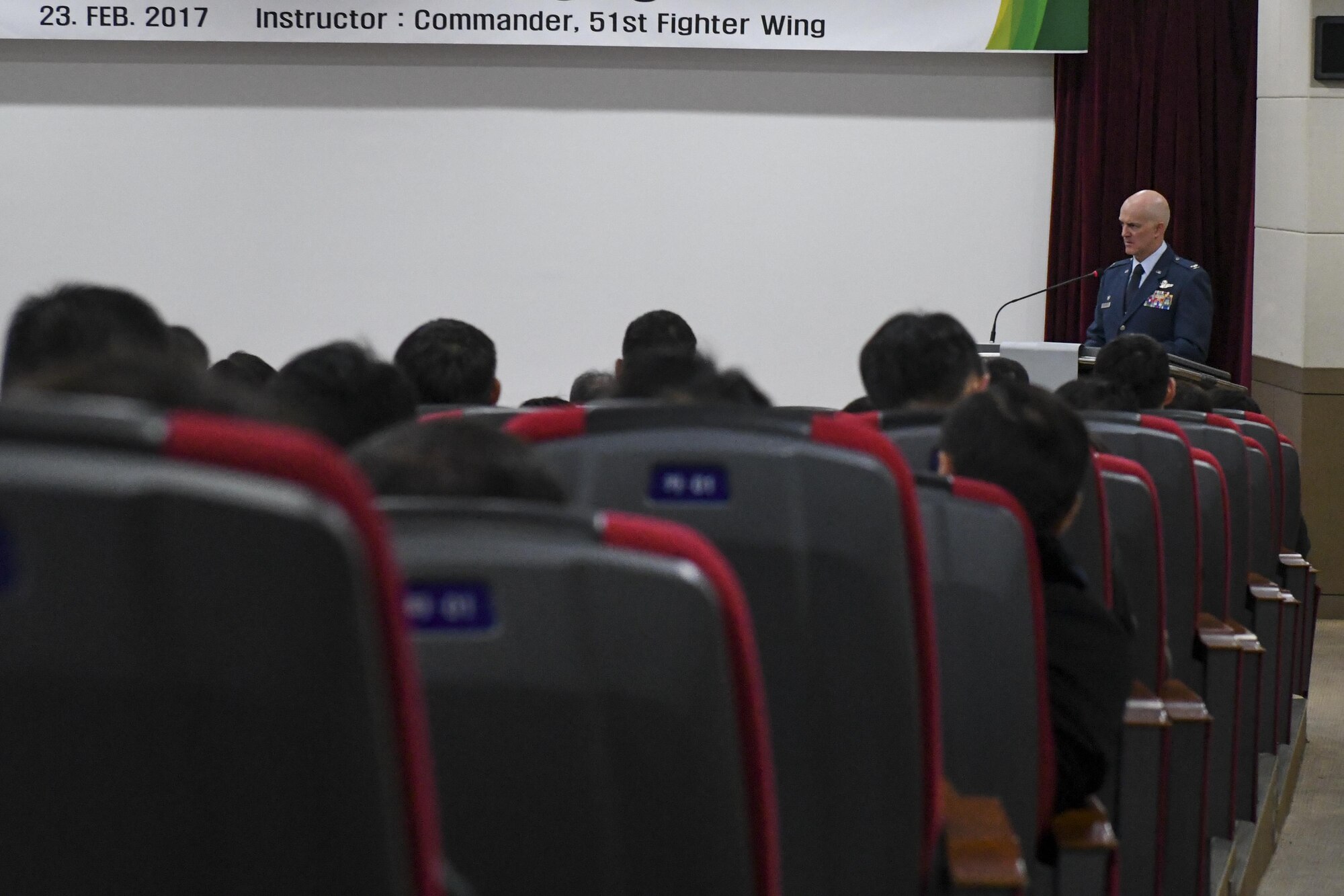U.S. Air Force Col. Andrew Hansen, 51st Fighter Wing commander, gives a speech to a crowd of Republic of Korea military officers and instructors at the ROK Joint Forces Military University, Feb. 23, 2017. Hansen provided the students, who are pulled from the ROK air force, army and navy, a first-hand explanation of why interoperability between military branches is so vital to successful operations. (U.S. Air Force photo by Staff Sgt. Victor J. Caputo)