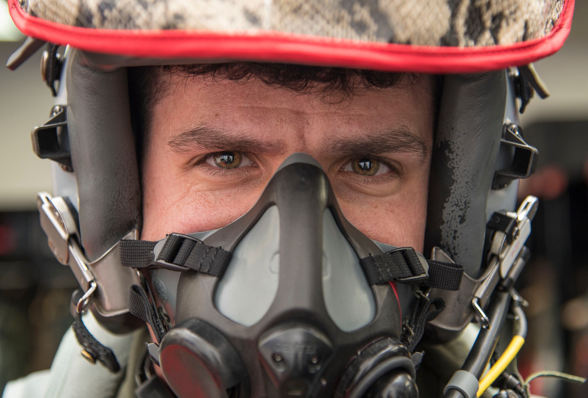 U.S. Air Force Capt. Jason Markzon, a 13th Fighter Squadron pilot, tests his MBU 20/P breathing mask at Misawa Air Base, Japan, Feb. 8, 2017. Before take-off, a preflight check is performed by aircrew flight equipments Airmen, ensuring all equipment functions properly. (U.S. Air Force photo by Airman 1st Class Sadie Colbert)