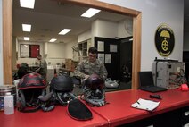U.S. Air Force Airman 1st Class Dominic Cicci, right, and Senior Airman Coty Buckley, left, both 35th Operations Support Squadron aircrew flight equipment technicians, perform pre-flight and post-flight inspections at Misawa Air Base, Japan, Feb. 8, 2017. The AFE shop oversees pilots' item serviceablility and restocks their uniform with supplies like water and food if needed. (U.S. Air Force photo by Airman 1st Class Sadie Colbert)