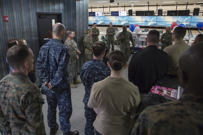 U.S. Marine Corps Sgt. Maj. Darnell T. Richardson, sergeant major of Headquarters and Headquarters Squadron, speaks to Marines and Sailors about the Active-Duty Fund Drive in support of the Navy-Marine Corps Relief Society during the drive’s kickoff event at the Strike Zone Bowling Center at Marine Corps Air Station Iwakuni, Japan, Feb. 24, 2017.  The NMCRS is a non-profit organization whose long-term mission is to help service members become financially self-sufficient by teaching them to manage their personal finances and prepare for unplanned expenditures. (U.S. Marine Corps photo by Lance Cpl. Carlos Jimenez)