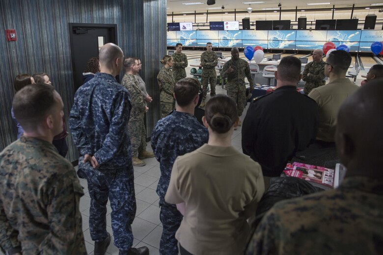 U.S. Marine Corps Sgt. Maj. Darnell T. Richardson, sergeant major of Headquarters and Headquarters Squadron, speaks to Marines and Sailors about the Active-Duty Fund Drive in support of the Navy-Marine Corps Relief Society during the drive’s kickoff event at the Strike Zone Bowling Center at Marine Corps Air Station Iwakuni, Japan, Feb. 24, 2017.  The NMCRS is a non-profit organization whose long-term mission is to help service members become financially self-sufficient by teaching them to manage their personal finances and prepare for unplanned expenditures. (U.S. Marine Corps photo by Lance Cpl. Carlos Jimenez)