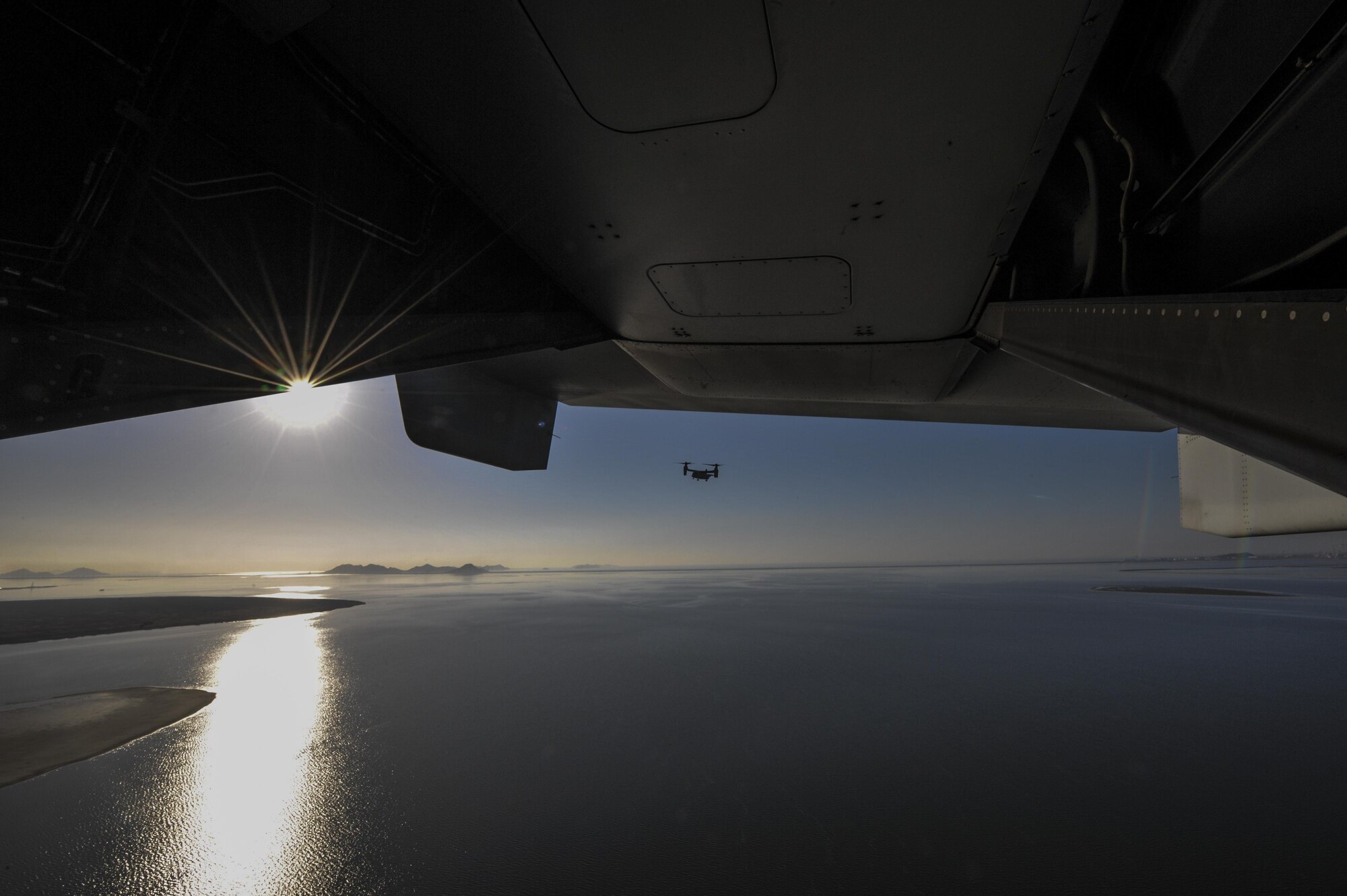 A U.S. Marine MV-22 Osprey flies over the Yellow Sea near Kunsan Air Base, Republic of Korea, Feb. 2, 2017. The MV-22s, assigned to Marine Corps Air Station Futenma, Okinawa, Japan, performed confined area landings patterns while training at Kunsan. (U.S. Air Force photo by Senior Airman Colville R. McFee)