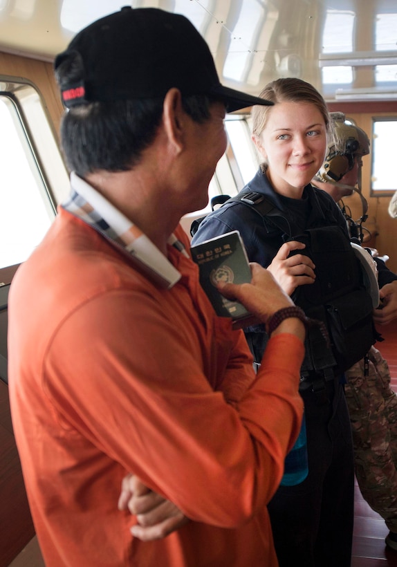 Navy Lt. j.g. Kirsten Asdal, right, talks to the captain of a foreign-flagged fishing vessel during an Oceania Maritime Security Initiative boarding mission in the Pacific Ocean, Feb. 15, 2017. Asdal is assigned to the USS Michael Murphy. Navy photo by Petty Officer 3rd Class Danny Kelley