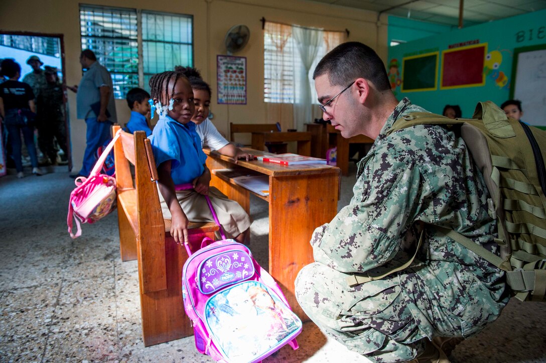 TRUJILLO, Honduras (Feb. 24, 2017) – Hospital Corpsman 1st Class Sean Mckay, a native of Bozeman, Mont., assigned to Navy Environmental and Preventative Medicine Unit (NEPMU) 2, Norfolk, Va., speaks with host nation school children during a preventative medicine site visit in support of Continuing Promise 2017's (CP-17) stop in Trujillo, Honduras. CP-17 is a U.S. Southern Command-sponsored and U.S. Naval Forces Southern Command/U.S. 4th Fleet-conducted deployment to conduct civil-military operations including humanitarian assistance, training engagements, and medical, dental, and veterinary support in an effort to show U.S. support and commitment to Central and South America. (U.S. Navy photo by Mass Communication Specialist 2nd Class Shamira Purifoy)