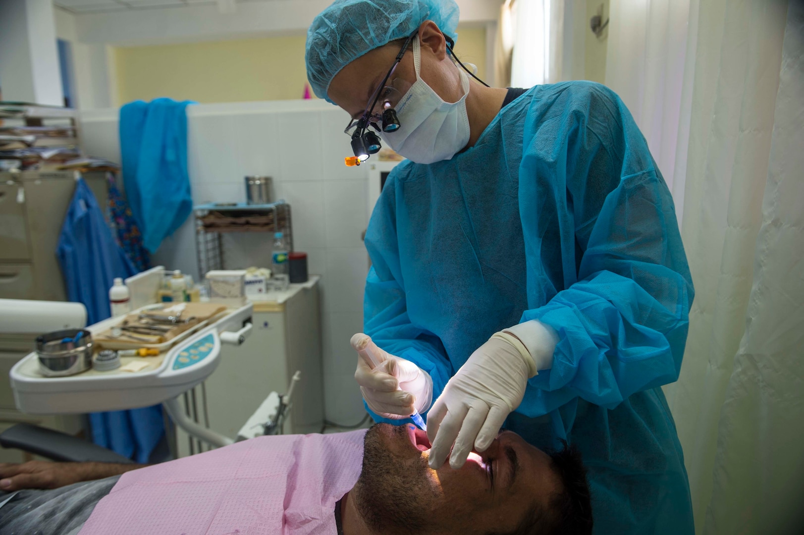 TRUJILLO, Honduras (Feb. 23, 2017) - Lt. Paula Davidson, a dentist and native of Casper, Wyo., assigned to Naval Health Branch Clinic Gulfport, Miss., performs a dental procedure at Hospital Salvador Paredes in support of Continuing Promise 2017’s (CP-17) visit to Trujillo, Honduras. CP-17 is a U.S. Southern Command-sponsored and U.S. Naval Forces Southern Command/U.S. 4th Fleet-conducted deployment to conduct civil-military operations including humanitarian assistance, training engagements, and medical, dental, and veterinary support in an effort to show U.S. support and commitment to Central and South America. (U.S. Navy Combat Camera photo by Mass Communication Specialist 2nd Class Brittney Cannady)