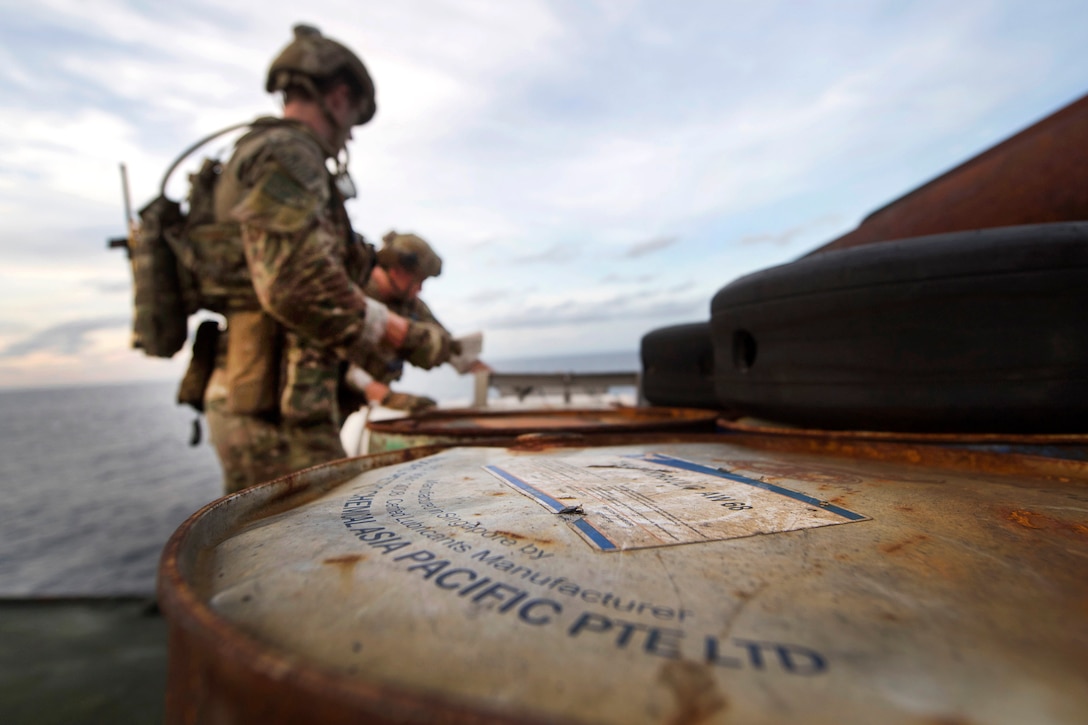 Coast Guardsmen conduct an initial safety sweep aboard a foreign-flagged fishing vessel during an Oceania Maritime Security Initiative boarding mission in the Pacific Ocean, Feb. 15, 2017. Navy photo by Petty Officer 3rd Class Danny Kelley