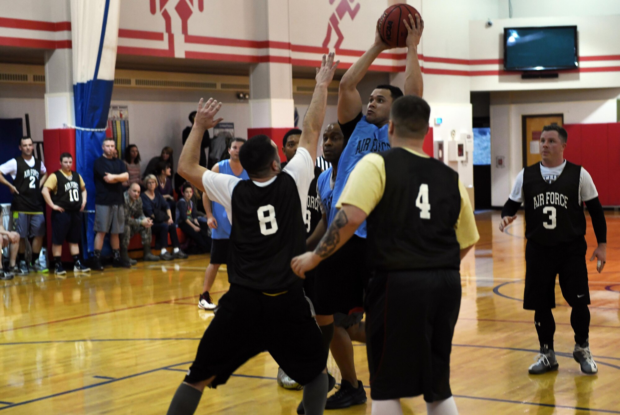 A member of the 911th Maintenance Group takes a shot during the final game of the 911th Airlift Wing Basketball Tournament at the Pittsburgh International Airport Air Reserve Station, Feb. 11, 2017. The 911th MXG and 911th Aeromedical Staging Squadron faced off after work on Saturday of the February UTA in the yearly game for the championship title. (U.S. Air Force photo by Staff Sgt. Marjorie A. Bowlden)