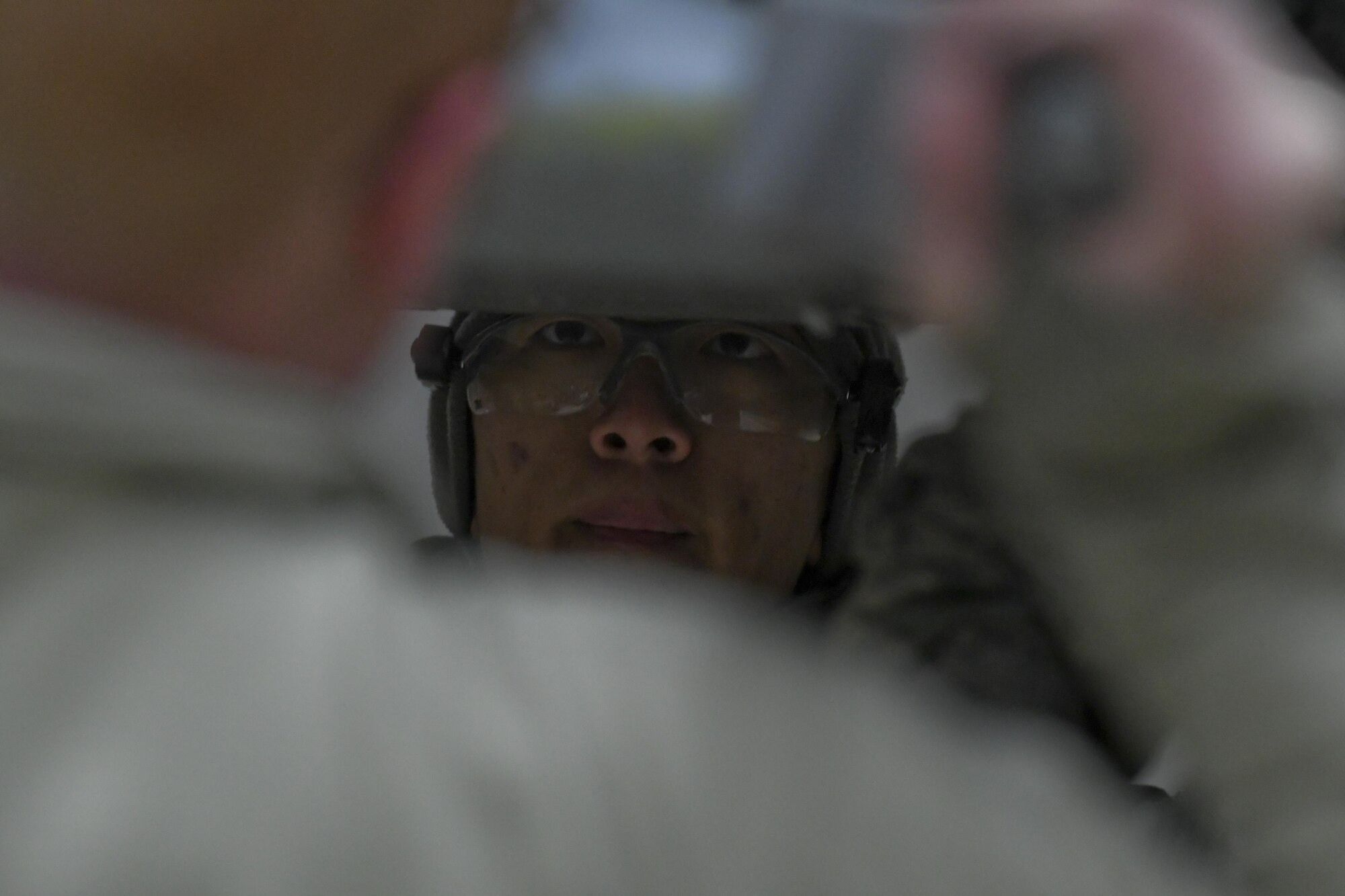 U.S. Air Force Senior Airman Huy Diep, 25th Aircraft Maintenance Unit weapons load crew member, helps hold a dual-rail adapter in place as it secured onto an A-10 Thunderbolt II, Feb. 27, 2017, during Exercise Beverly Herd 17-1 at Osan Air Base, Republic of Korea. Exercise Beverly Herd 17-1 tested the 51st Maintenance Group’s capability to quickly generate airpower. (U.S. Air Force photo by Staff Sgt. Victor J. Caputo)