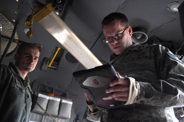 Tech. Sgt. Benjamin Sardon and Staff Sgt. Jacob Liebel, communication and navigation systems technicians with the 911th Aircraft Maintenance Squadron, perform a functional check on the Real Time In Cockpit modification at the Pittsburgh International Airport Air Reserve Station, Feb. 8, 2017. RTIC was installed in five of the eight C-130 Hercules aircraft assigned to the 911th Airlift Wing to improve situational awareness of pilots. (U.S. Air Force photo by Staff Sgt. Marjorie A. Bowlden)