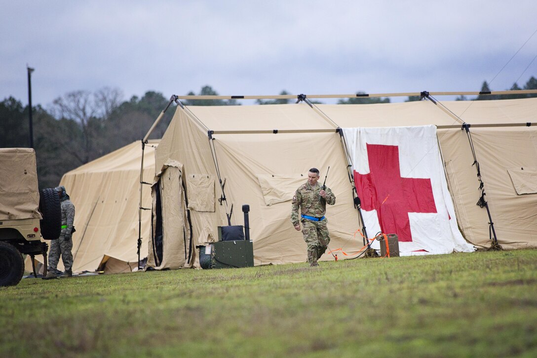 Tech. Sgt. Kurtis Crawford, loadmaster, 512th Airlift Control Flight, speaks to their flight line command and control center during airfield training at Fort Polk, Louisiana, Feb. 15, 2017. Crawford joined members of the 512th Airlift wing for training and provided support to Army units who were also training at JRTC. (U.S. Air Force photo/Capt. Bernie Kale)