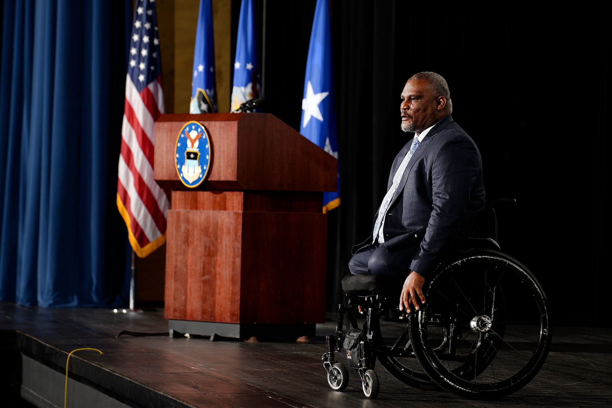 Retired Army Col. Greg Gadson, the keynote speaker for this year's National Character and Leadership Symposium at the U.S. Air Force Academy, speaks from the stage in Arnold Hall, Feb. 23, 2017. Gadson spoke about the value of developing character at the symposium. He lost his legs to a roadside bomb in 2007. (U.S. Air Force photo/Mike Kaplan)  