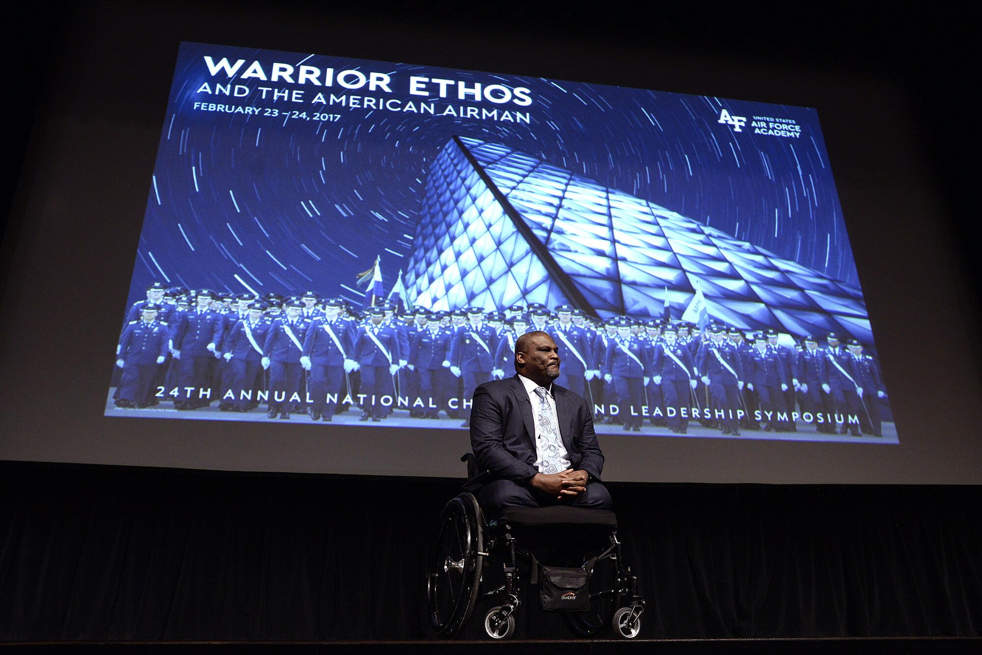Retired Army Col. Greg Gadson, the keynote speaker for this year's National Character and Leadership Symposium at the U.S. Air Force Academy, speaks from the stage in Arnold Hall, Feb. 23, 2017. Gadson spoke about the value of developing character at the symposium. He lost his legs to a roadside bomb in 2007. (U.S. Air Force photo/Mike Kaplan)  
