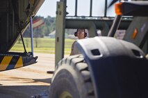 Tech. Sgt. John Rizzo, air transportation, 46th Aerial Port Squadron, spots an all-terrain forklift during flight line operations at the Joint Readiness Training Center, Fort Polk, Louisiana, Feb. 15, 2017. Rizzo joined other Airmen from the 512th Airlift Wing located at Dover Air Force Base, Del., to conduct training and provide support to Army units who were training also at JRTC. (U.S. Air Force photo/Capt. Bernie Kale)