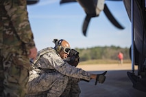 Tech. Sgt. Stephen Thomas, air transportation, 71st Aerial Port Squadron, gives a 'thumbs up' that there is enough room to load equipment onto an aircraft during flight line operations at the Joint Readiness Training Center, Fort Polk, Louisiana, Feb. 15, 2017. Thomas joined other Airmen from the 512th Airlift Wing located at Dover Air Force Base, Del., to conduct training and provide support to Army units who were training also at JRTC. (U.S. Air Force photo/Capt. Bernie Kale)