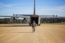 Tech. Sgt. Kurtis Crawford, loadmaster, 512th Airlift Control Flight, leaves the flight line after assisting with the loading of an aircraft at the Joint Readiness Training Center, Fort Polk, Louisiana, Feb. 15. 2017. Crawford joined Airmen from the 512th Airlift Wing located at Dover Air Force Base, Del., to conduct airfield training and provide support to Army units who were training at the JRTC area. (U.S. Air Force photo/Capt. Bernie Kale)
