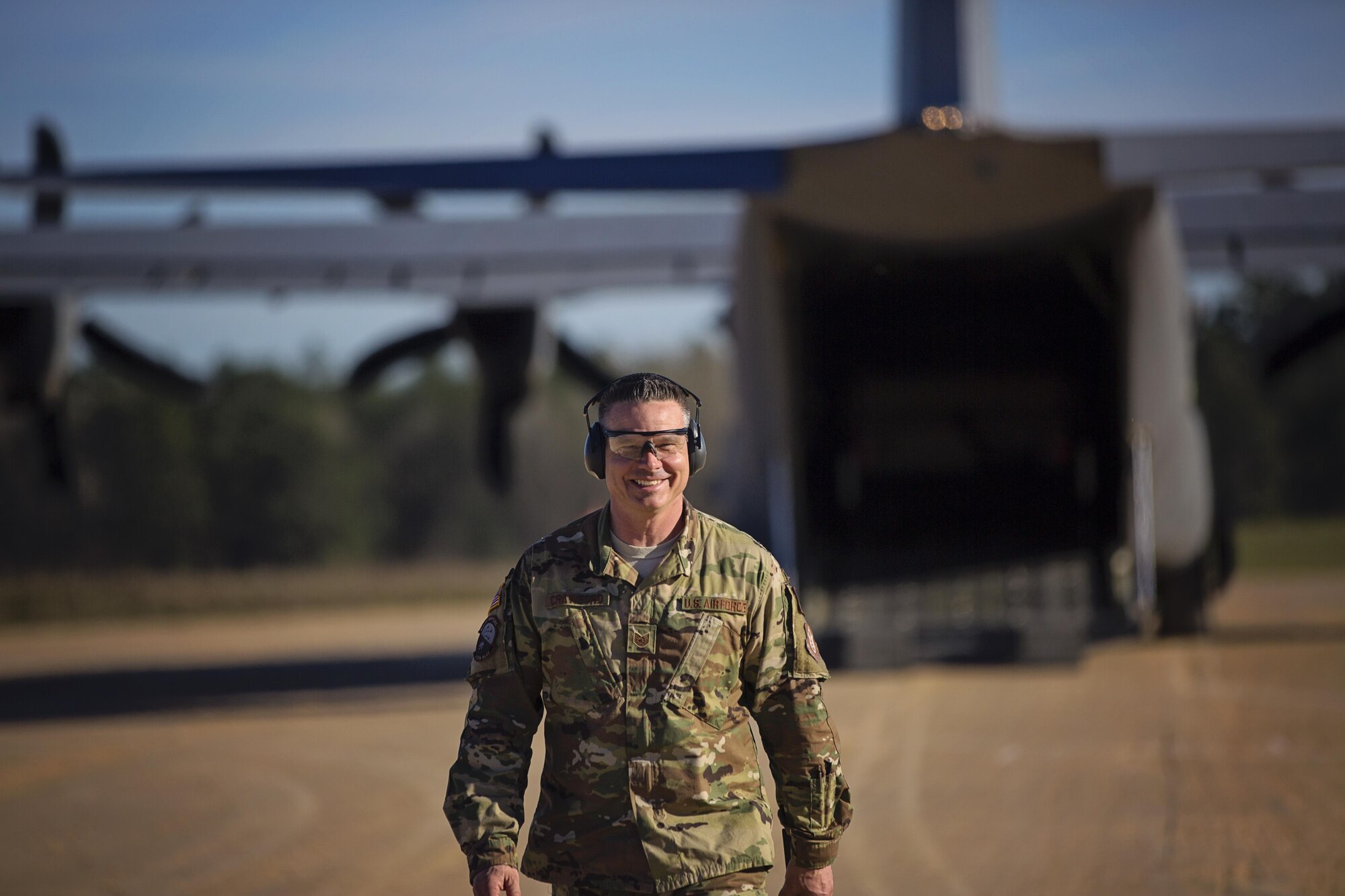 Tech. Sgt. Kurtis Crawford, loadmaster, 512th Airlift Control Flight, leaves the flight line after assisting with the loading of an aircraft at the Joint Readiness Training Center, Fort Polk, Louisiana, Feb. 15. 2017. Crawford joined Airmen from the 512th Airlift Wing located at Dover Air Force Base, Del., to conduct airfield training and provide support to Army units who were training at the JRTC area. (U.S. Air Force photo/Capt. Bernie Kale)