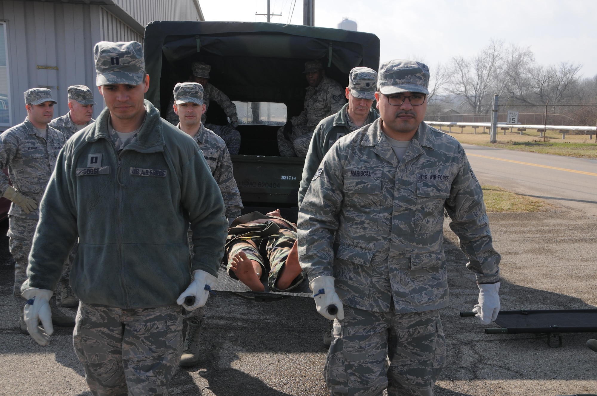 445th Aeromedical Staging Squadron Airmen Capt. Moises Googe, flight surgeon, and Senior Airman Julio Mariscal, surgical services journeyman, help off-load a simulated wounded Airman in need of medical treatment from a vehicle during a training event Feb. 12, 2017. The training event consisted of litter transport and CCAT (Critical Care Air Transport Team) training. Each unit training assembly weekend will have one dedicated day of such training to prepare ASTS Airmen for the August 2017 Patriot Warrior exercise,  the Air Force Reserve Command portion of an immense joint field exercise involving nearly 6,000 Airmen, Sailors, Soldiers, and multinational forces. (U.S. Air Force photo/Tech. Sgt. Anthony Springer)