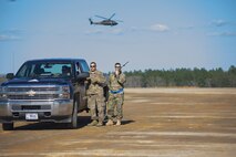 Tech. Sgt. Kurtis Crawford, loadmaster, 512th Airlift Control Flight, talks to the flight line team at the Joint Readiness Training Center, Fort Polk, Louisiana, Feb. 15. 2017. Crawford joined Airmen from the 512th Airlift Wing located at Dover Air Force Base, Del., to conduct airfield training and provide support to Army units who were training at the JRTC area. (U.S. Air Force photo/Tech. Sgt. Nathan Rivard)