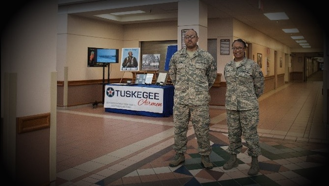 Master Sgt. William Jackson, 27th Special Operations Aerospace Medical Squadron superintendent, and Tech. Sgt. Anssa Knight, 27th Special Operations Medical Support Squadron NCO in charge of diagnostic imaging, pose in front of a display commemorating Black History Month Feb. 2, 2017 at Cannon Air Force Base, N.M. Jackson and Knight gave their own money and time to achieve their vision of creating education-focused displays and programming honoring Black History Month. (U.S. Air Force Photo by Senior Airman Shelby Kay-Fantozzi/released) 