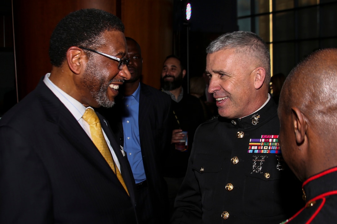 Major General Paul J. Kennedy, Commanding General of Marine Corps Recruiting Command, speaks to Dr. Ronald L. Carter, president of Johnson C. Smith University, during the Central Intercollegiate Athletic Association (CIAA) President’s Dinner at the Spectrum Center in Charlotte, N.C., Feb. 24, 2017. The Marines take part in the President’s Dinner at the CIAA to help spread awareness and inform others of educational and career opportunities that the Marine Corps can provide. The President’s Dinner assists recruiters by offering them different tools to reach students across the state. (U.S. Marine Corps photo by Lance Cpl. Jack A. E. Rigsby/Released)