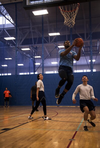 Airman 1st Class Andre Davis, 92nd Force Support Squadron intramural sports coordinator, goes to the hoop to score during the 92nd Mission Support Squadron Fun Day Feb. 24, 2017, at Fairchild Air Force Base. The day-long event included numerous activities to provide 92nd MSG Airmen and their families a healthy community and safe environment to grow and bond.