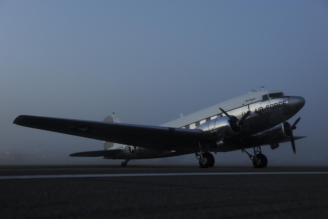 C-47A-60-DL Skytrain, serial # 43-30665, N47E, in polished aluminum and white top seen in the early morning fog at Sun-N-Fun 2014. This aricraft was built  by the Douglas Aircraft Company in 1943 and served with the U.S. Army until the 1950s. Then it was sent to the Oklahoma National Guard. Later it was returned to the Army, which used it as a test platform until 1966. Photo courtesy Greg L. Davis.