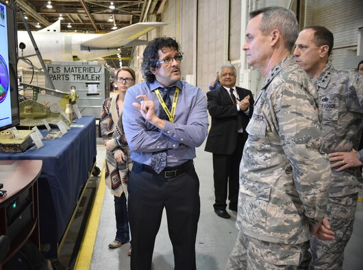 Mark Estorga, 564th Aircraft Maintenance Squadron director, discusses the programmed depot maintenance process on the KC-135 with Lt. Gen. Darryl Roberson, Air Education and Training Command commander, second from right, while Lt. Gen. Lee K. Levy II, Air Force Sustainment Center commander, right, looks on. During his tour of Tinker Air Force Base on Feb. 14, General Roberson received briefings from Tinker leadership and toured the Oklahoma City Air Logistics Complex and the B-2 facility. (Air Force photo by Darren D. Heusel)
