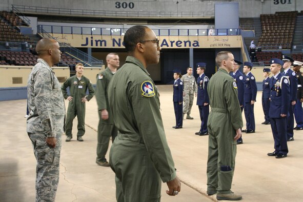 From left to right: 2nd Lt. Shawn Avery, 72nd Force Support Squadron; 1st Lt. Michael Fischer, 963rd Airborne Control Squadron; Maj. Sean Fazande, 966th Airborne Air Control Squadron; 1st Lt. Joseph Mollenkamp, 963rd AACS; and Staff Sgt. Kavious Manley, 964th AACS, judge the drill competition of the Junior ROTC at the Jim Norrick Arena Feb. 18. There were 240 students from nine high schools competing. Some 56 volunteers from across Tinker Air Force Base mentored and judged the competition.  Staff Sgt. Joshua from the 552nd Operations Squadron served as the event director and said, “Mentoring the next generation is laying the ground work for success. When you see those you’ve mentored become what you were driving them to become, all the work, long hours, and moments you wanted to give up, but didn’t, become worthwhile and you feel a true sense of achievement.” The awards were presented by Col. Michael Green, 72nd Mission Support Squadron commander. “Precision is what makes the performance great, and sometimes it is focused on the individual but sometimes it is focused on the unit,” said Colonel Green. “Precision doesn’t just happen. Think about how your routine looked the first time you tried it. Now think about how you performed this evening — you persevered.” The colonel told the students they could be proud of their accomplishments and encouraged them to always do their best. (Air Force photo by Kimberly Woodruff)