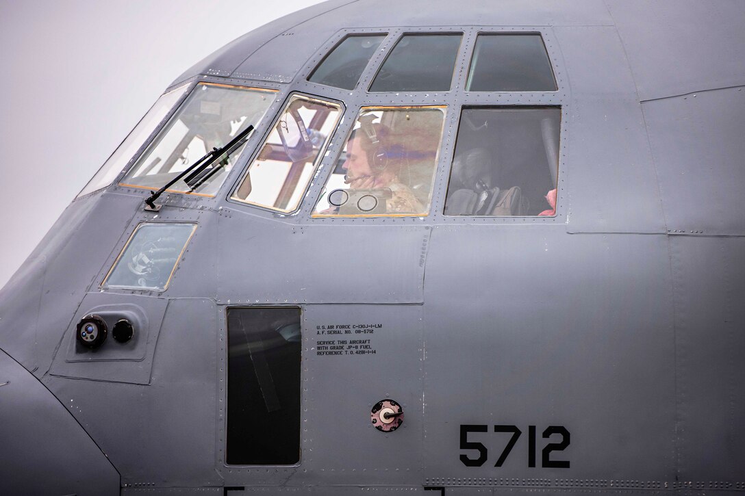 Air Force Capt. Andy Edmund performs a cockpit systems check inside his C-130J Hercules aircraft before a mission at Camp Bastion, Afghanistan, Feb. 17, 2017. Edmund is a pilot assigned to the 774th Expeditionary Airlift Squadron. Air Force photo by Staff Sgt. Katherine Spessa 