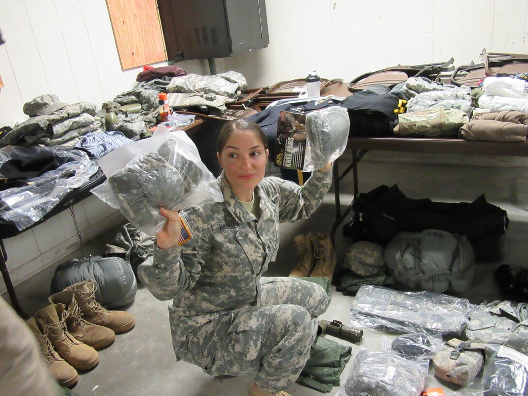 Army Reserve Staff Sgt. Arin R. Kinsella from the 380th Quartermaster Battalion headquartered in Evansville, Ind., 38th Regional Support Group, 310th Sustainment Command (Expeditionary), participates in the equipment list layout inventory and inspection while competing in the 310th ESC's 2017 Best Warrior Competition, held at Ft. A.P. Hill, Va., Feb. 23 - 28. The annual six day competition tests enlisted Soldiers and noncommissioned officers in their ability to perform Army Warrior tasks in a variety of events leading to the 377th Theater Support Command's BWC, which is a feed to the U.S. Army Reserve Command Best Warrior. (U.S. Army photo by Spc. Nicole R. Cabanellas)