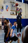 Henriksen Liberis, 4th Space Operations Squadron, puts up a jump shot during the intramural basketball championship game at Schriever Air Force Base, Colorado, Thursday, Feb. 23, 2017. Liberis scored 11 second-half points to help lead 4 SOPS to the title with a 58-38 win over the U.S. Air Force Warfare Center. (U.S. Air Force photo/Christopher DeWitt)