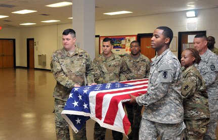 U.S. Army Reserve Soldiers, Staff Sgt. Gregory P. Fancy II, left, with 365th Combat Support Sustainment Battalion (CSSB), 321st Sustainment Brigade, 143rd Expeditionary Sustainment Command, 377th Theater Sustainment Command, Staff Sgt. Ariel DeLeon, Sgt. Brandon Shaw, Sgt. 1st Class Laverne Cohill, all with the 412th Theater Engineer Command, and Sgt. Luis Gonzalez, 365th CSSB, practice their roles as military funeral honor pallbearers at the Command headquarters in Vicksburg, Miss., Jan. 20, 2017. Sgt. 1st Class Corey Abel, far right, with the TEC oversees the detail. 