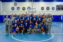 4th Space Operations Squadron members celebrate following their 58-38 win over the U.S. Air Force Warfare Center in the intramural basketball championship game at Schriever Air Force Base, Colorado, Thursday, Feb. 23, 2017. 4 SOPS earned the title and redemption for a loss to USAFWC in the 2016 championship game. (U.S. Air Force photo/Christopher DeWitt)