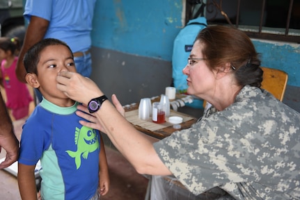 U.S. Army Maj. Rhonda Dyer, Joint Task Force-Bravo Medical Element, provides deworming medication to a child during a Medical Readiness Training Exercise in Corinto, Cortes, Feb. 16, 2017. The two-day exercise provided service for 747 patients. 
(U.S. Army photo by Maria Pinel)
