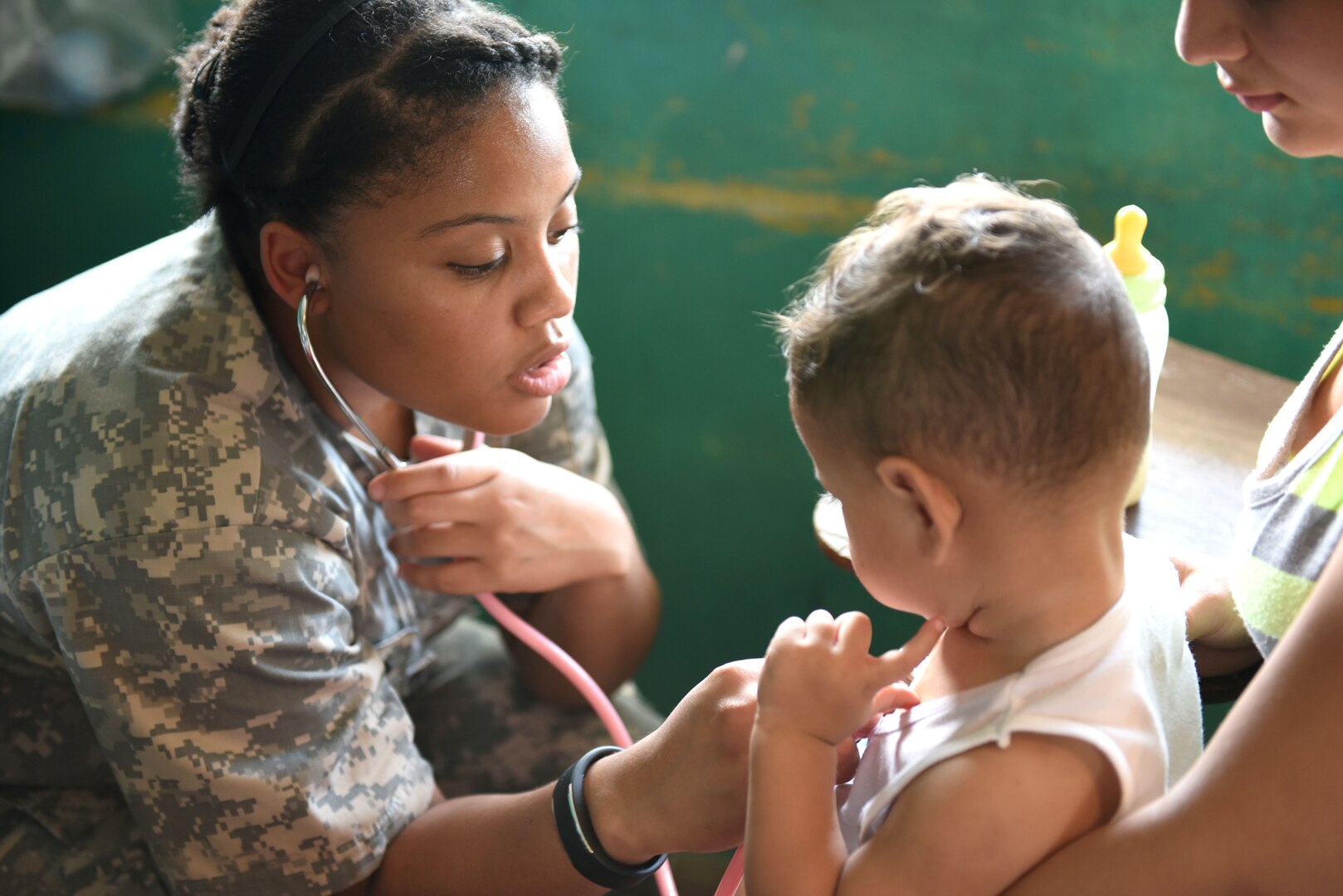 U.S. Army Spc. Gloria Galbearth, Joint Task Force-Bravo Medical Element, checks a child’s vital signs during a Medical Readiness Training Exercise in Corinto, Cortes, Feb. 16, 2017. Galbearth was assigned to the filtering section of the MEDRETE where patients were examined prior to seeing a provider. (U.S. Army photo by Maria Pinel)