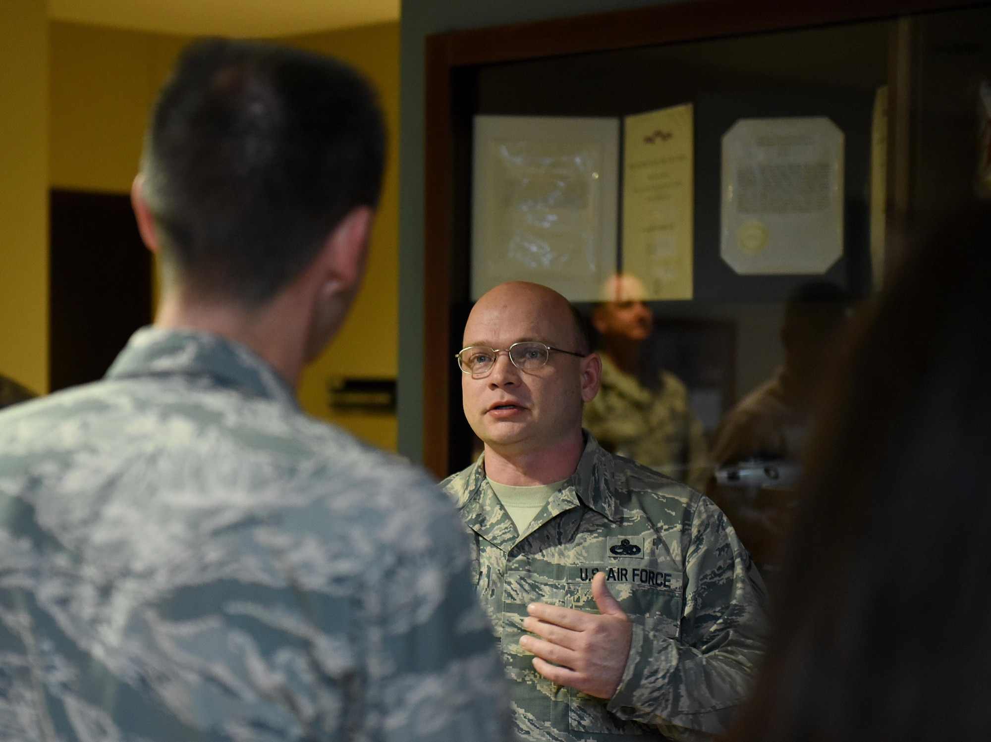 U.S. Air Force Master Sgt. Christopher Murdock (right), 4th Maintenance Group development and instruction section chief, speaks to Maj. Gen. Scott Zobrist, 9th Air Force commander, about the Make It Better computer  club at Seymour Johnson Air Force Base, N.C., Feb. 15, 2017. The Make It Better initiative began in 2014 and encourages members with similar interests and hobbies to join forces to improve morale and camaraderie of Team Seymour Airmen and families. (U.S. Air Force photo by Airman 1st Class Kenneth Boyton)