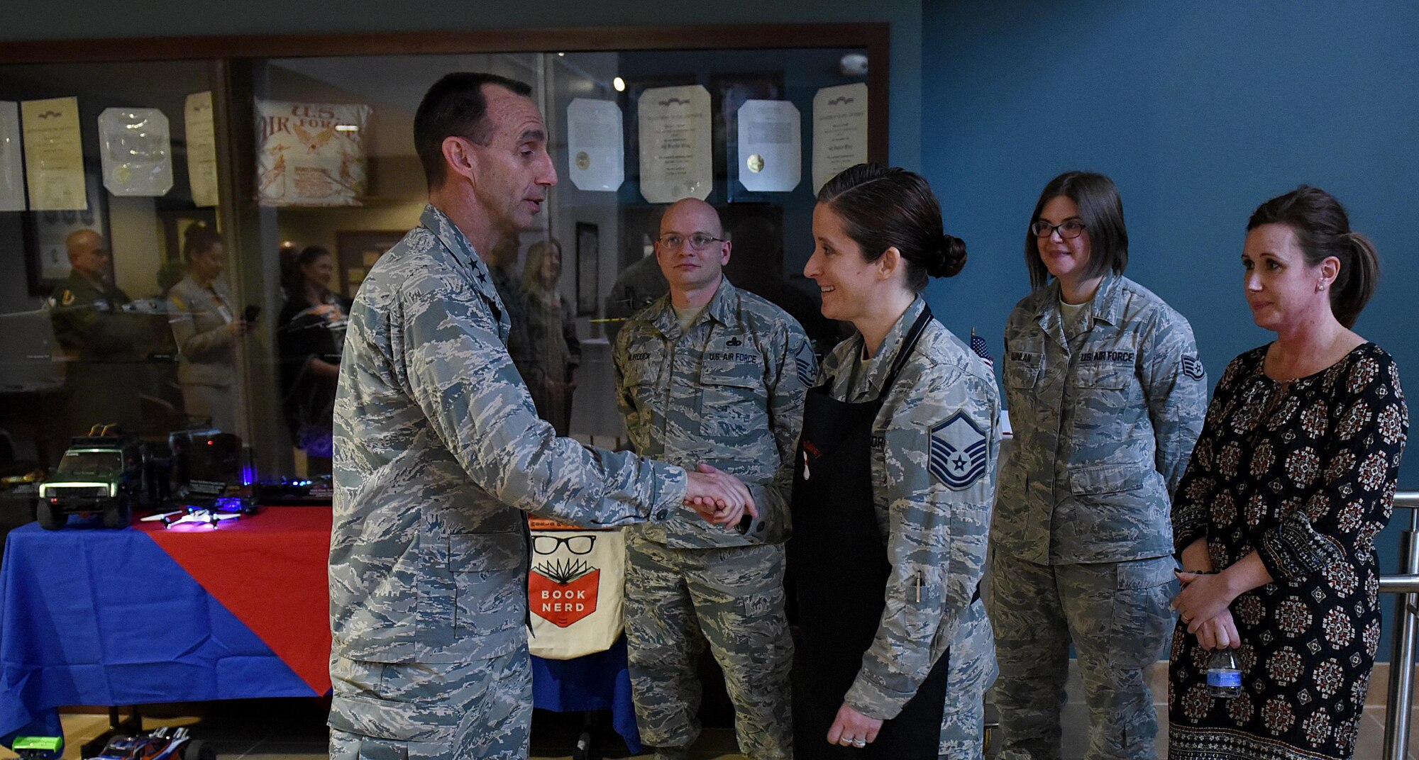 U.S. Air Force Maj. Gen. Scott Zobrist (left), 9th Air Force commander, coins Master Sgt. Katie Neeley, 4th Aerospace Medicine Squadron superintendent at Seymour Johnson Air Force Base, N.C., Feb. 15, 2017. Neeley is the president of the Make It Better culinary club. (U.S. Air Force photo by Airman 1st Class Kenneth Boyton)