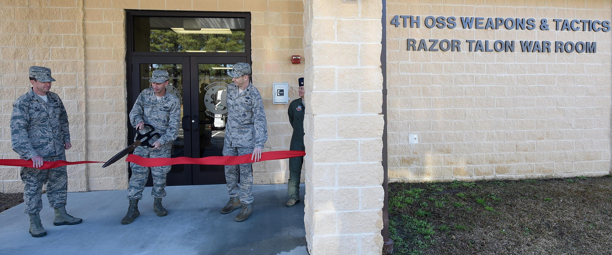 U.S. Air Force Maj. Gen. Scott Zobrist, 9th Air Force commander, cuts the ribbon at the grand opening of the 4th Operations Support Squadron Weapons and Tactics Razor Talon War Room at Seymour Johnson Air Force Base, N.C., Feb. 15, 2017. The new war room will help support joint exercises between military branches during Razor Talon, a monthly low-cost, large-force training exercise for aviation units along the East Coast.  (U.S. Air Force photo by Airman 1st Class Kenneth Boyton)